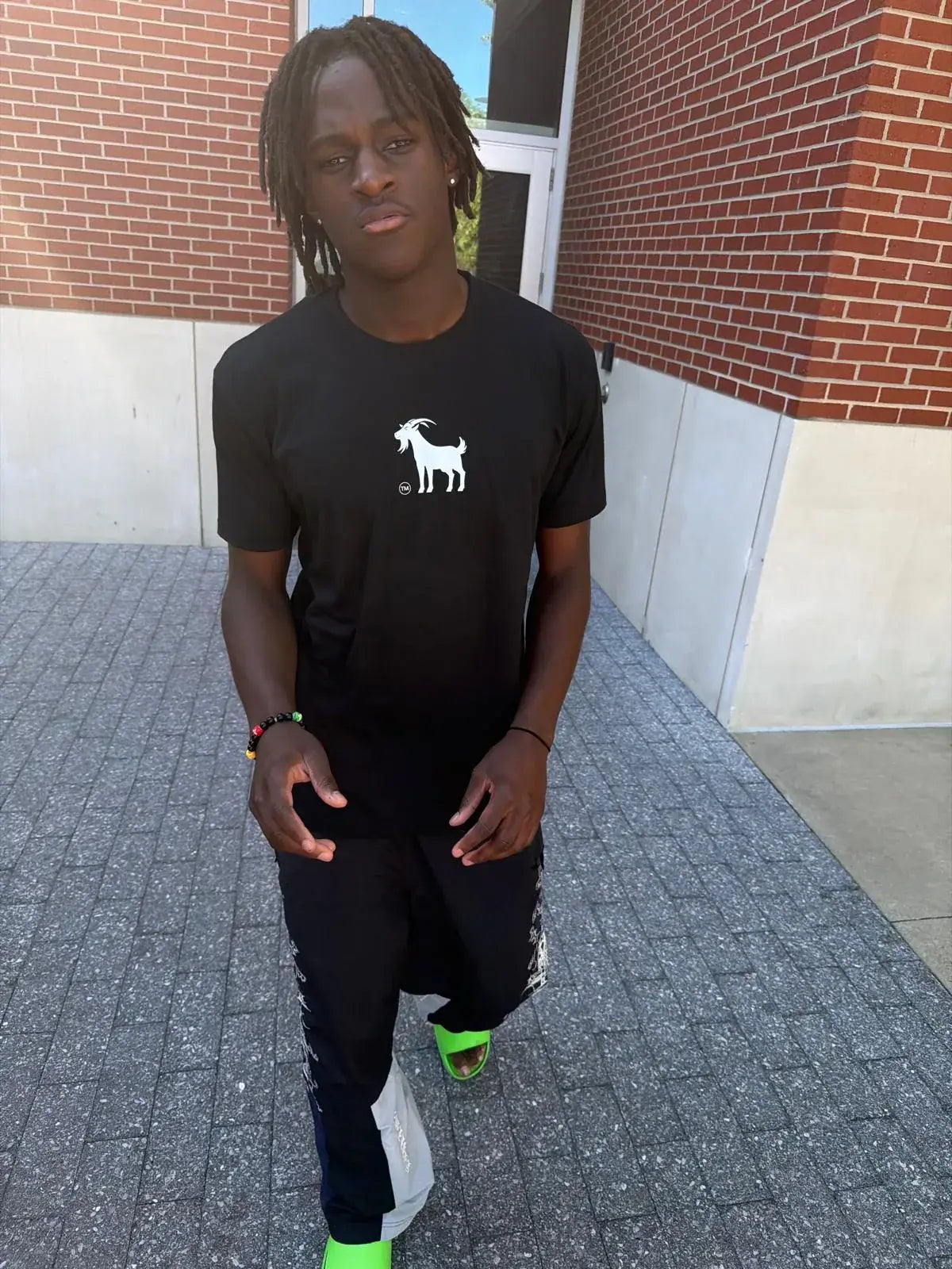 Abdou Toure in a black Goatville tee